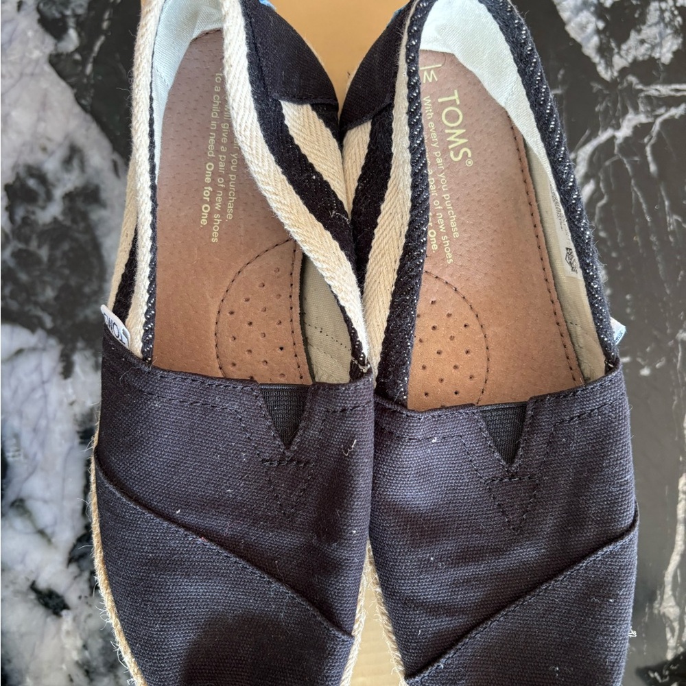 TOMS Black and White Canvas Slip-Ons